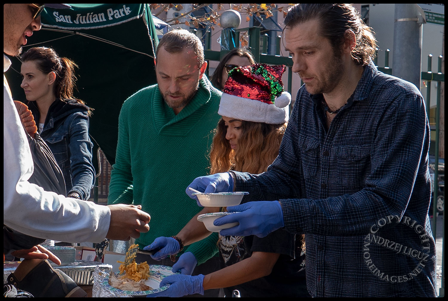 Anisa, Ayler & Naz with Oscar feeding the homeless, San Julian Park, Skid Row, LA, Christmas Day 2018