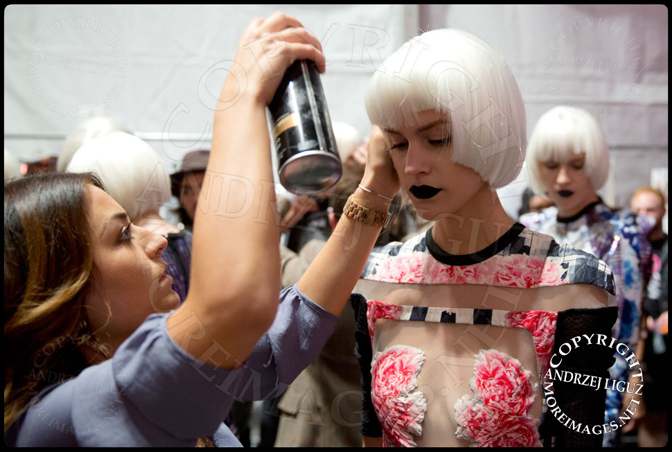 Applying the finishing touches to the models for the Falguni & Shane Peacock Spring & Summer 2014 show at NYC Fashion Week © Andrzej Liguz/moreimages.net. Not to be used without permission